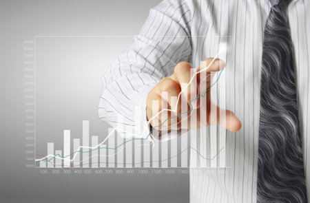 businessman with financial symbols coming from handの写真素材