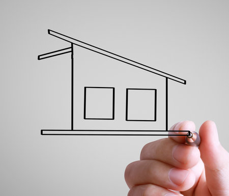 Hand drawing a houseの写真素材