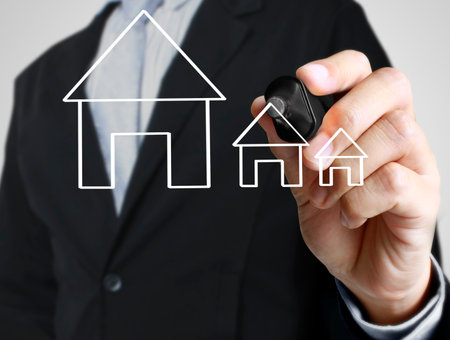 Hand drawing a houseの写真素材