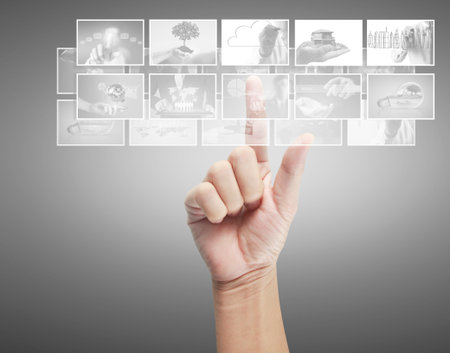 Hand touching screen ,Closeup of  hand pointingの写真素材