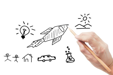 Hand holds pencil draws back to schoolの写真素材