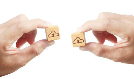 Concept creative idea and innovation. wooden cube block in hand with symbolの写真素材
