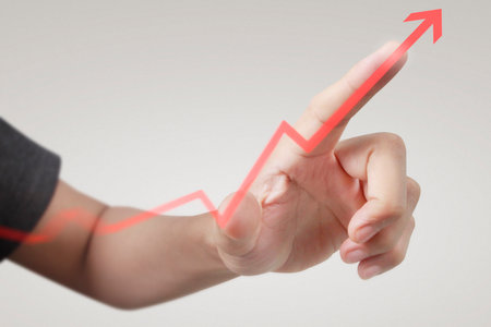 Hand touching a graphs of financial indicator and accounting market economy analysis chartの写真素材