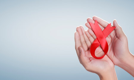 Healthcare and medicine. hands holding ribbon