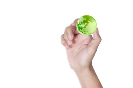 Globe  in human hand, holding our planet glowing.の写真素材