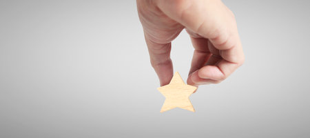 Hand of putting increase wood five star shape.The best excellent business services rating customer experience conceptの写真素材