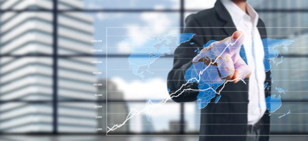 Hand touching a graphs of financial indicator and accounting market economy analysis chartの写真素材