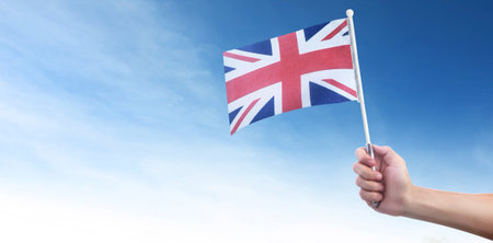 Hand holding English flag. flag in a hand