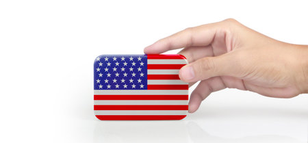 Hand holding american flag. usa flag in a handの写真素材