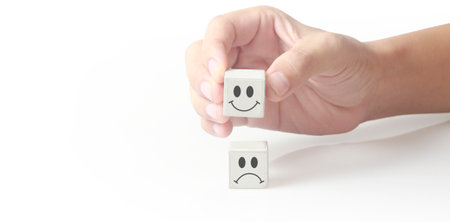 Concept creative idea and innovation. Cube block in hand with symbolの写真素材