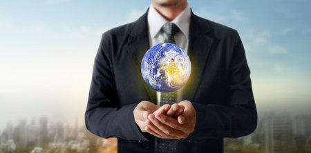 Globe ,earth in human hand, holding our planet glowing. Earth image providedの写真素材