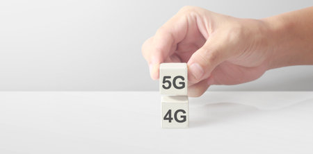 Concept creative idea and innovation. Cube block in hand with symbolの写真素材