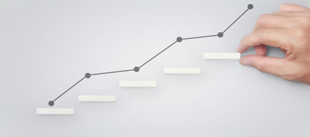 Block stacking as step stair in hand. Business concept for growth success processの写真素材