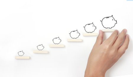 Block stacking as step stair in hand. Business concept for growth success processの写真素材