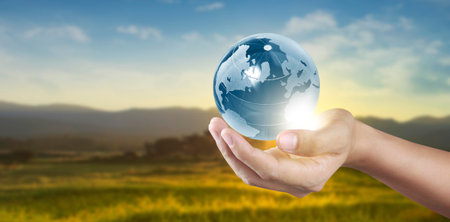 Globe in hand, Earth energy saving conceptの写真素材