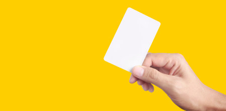 Close up of hand holding virtual card with. Credit card in hand isolatedの写真素材