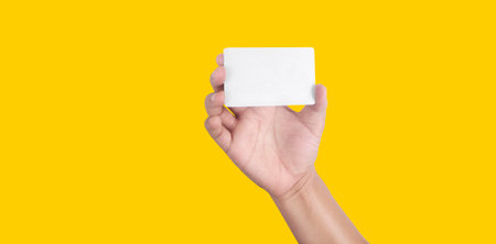 Close up of hand holding virtual card with. Credit card in hand isolatedの写真素材