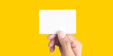 Close up of hand holding virtual card with. Credit card in hand isolatedの写真素材