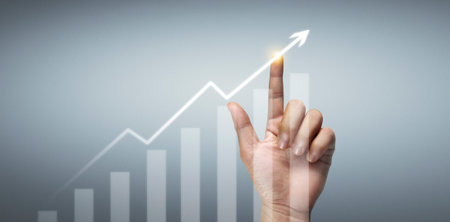 Hand touching  graphs of financial indicator and accounting market economy analysis chartの写真素材