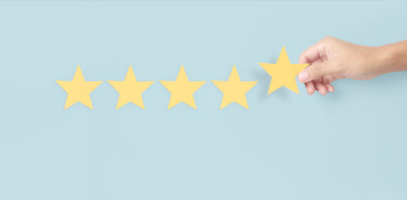 Hand of touching rise on increasing five stars. Increase rating evaluation and classification...