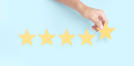Hand of touching rise on increasing five stars. Increase rating evaluation and classification...
