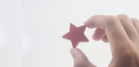 Rise on increasing stars in human hand, Increase rating evaluation classification conceptの写真素材