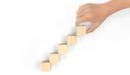 Business connecting piece of multi wood chart blocks steps in a handの写真素材