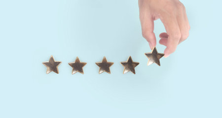 Rise on increasing five stars in human hand, Increase rating evaluation classification concept