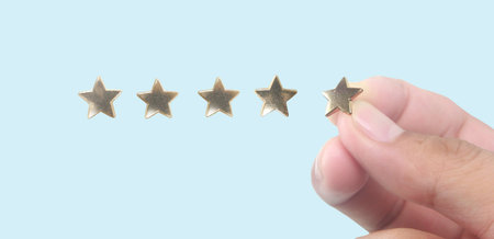 Rise on increasing five stars in human hand, Increase rating evaluation classification concept