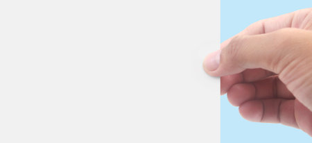 Hands holding paper blank for a letter paperの写真素材