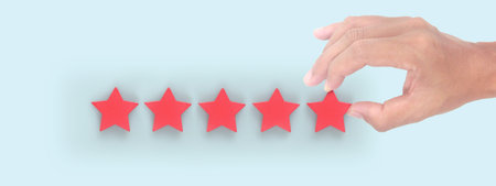 Rise on increasing five stars in human hand, Increase ratingの写真素材