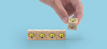 Wooden cubes in hand with copy space for input wording and infographicの写真素材