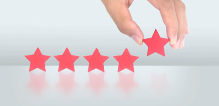 Rise on increasing five stars in human hand, Increase rating evaluation classification conceptの写真素材
