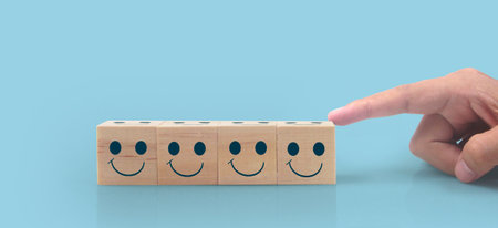 Wooden cubes in a hand with copy space for input wordingの写真素材