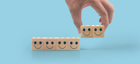 Wooden cubes in a hand with copy space for input wordingの写真素材