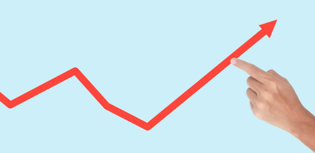 Hand touching graphs of financial indicator and accounting market economy analysis chartの写真素材
