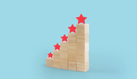 Wooden blocks with the five star symbol Increase rating, Customer experienceの写真素材