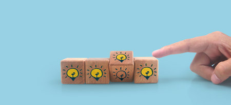 Wooden cubes in a hand with copy space for input wording and infographicの写真素材