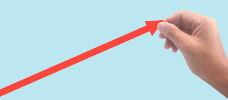 Hand touching graphs of financial indicator and accounting market economy analysis chartの写真素材