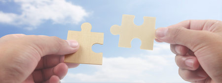 Connecting jigsaw puzzle. Business solutions success and strategy conceptの写真素材