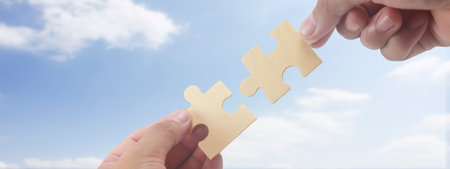 Connecting jigsaw puzzle. Business solutions success and strategy conceptの写真素材
