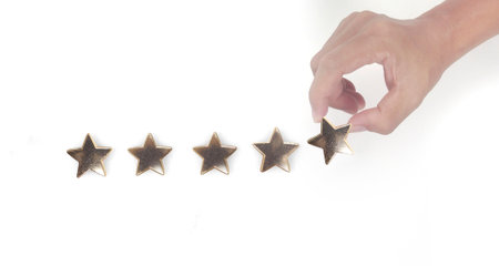 Rise on increasing five stars in human hand, Increase rating evaluation classification conceptの写真素材