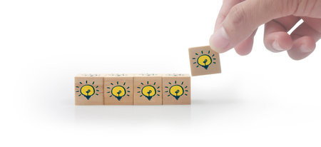 Wooden cubes in hand with copy space for input wording and infographicの写真素材