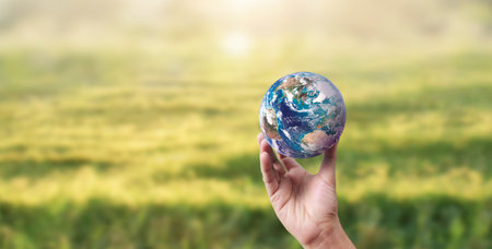 Globe ,earth in human hand, holding our planet glowing.