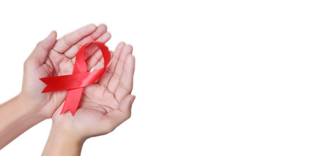 Healthcare  medicine. hands holding ribbon