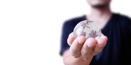 holding a glowing earth globe in his hand