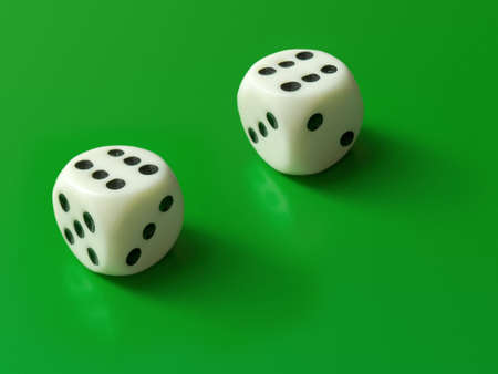 Two dices (only six) on green backgroundの写真素材
