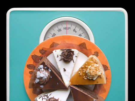Chocolate cake on weigh-scale - help!の写真素材