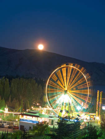 Attraction and Moon in nightの写真素材