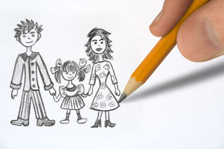 Drawing Happy family, pencil in hand closeupの写真素材